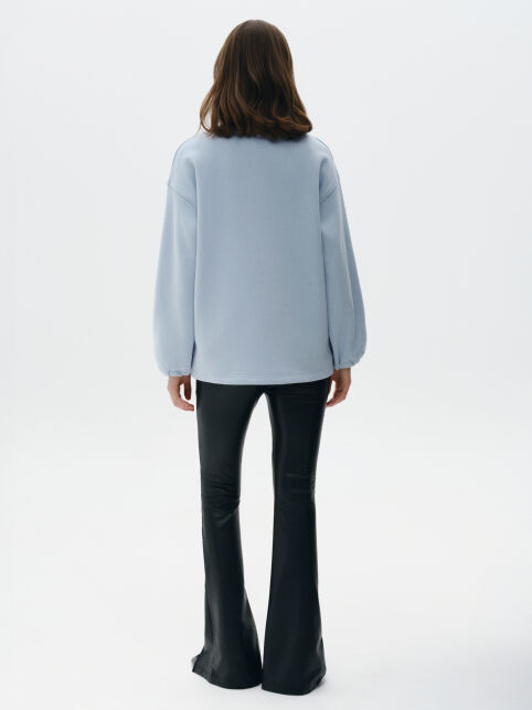 Брюки-клёш из экокожи с разрезами и рельефными швами LBK 3215 - купить в интернет-магазине Conte